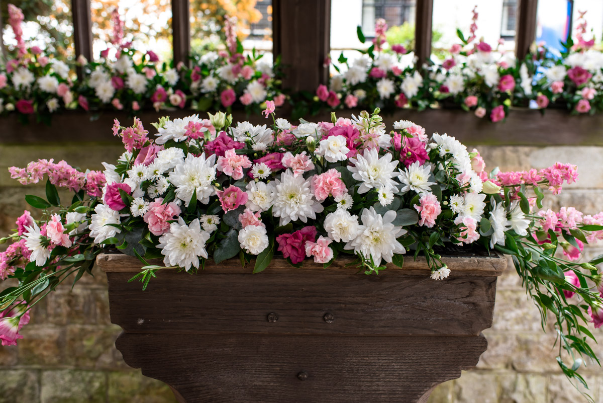 Photograph of flowers decorating church entrance