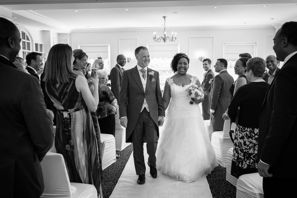 photograph of darren and Juliette after their wedding ceremony at The Hythe Imperial in Kent