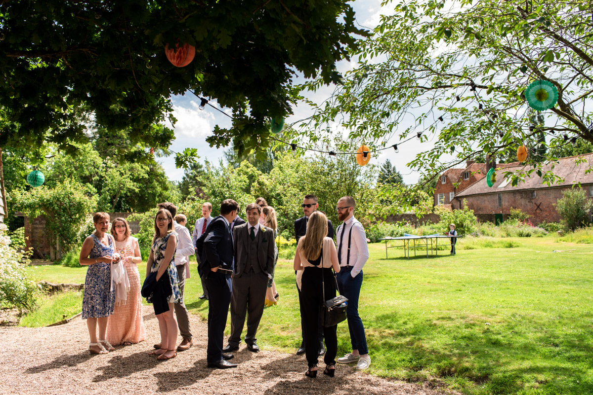 Photograph of wedding guests outside Ratsbury Barn in Kent