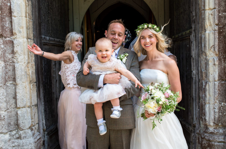 Photograph of bride and groom outside St Marys Church in Kent