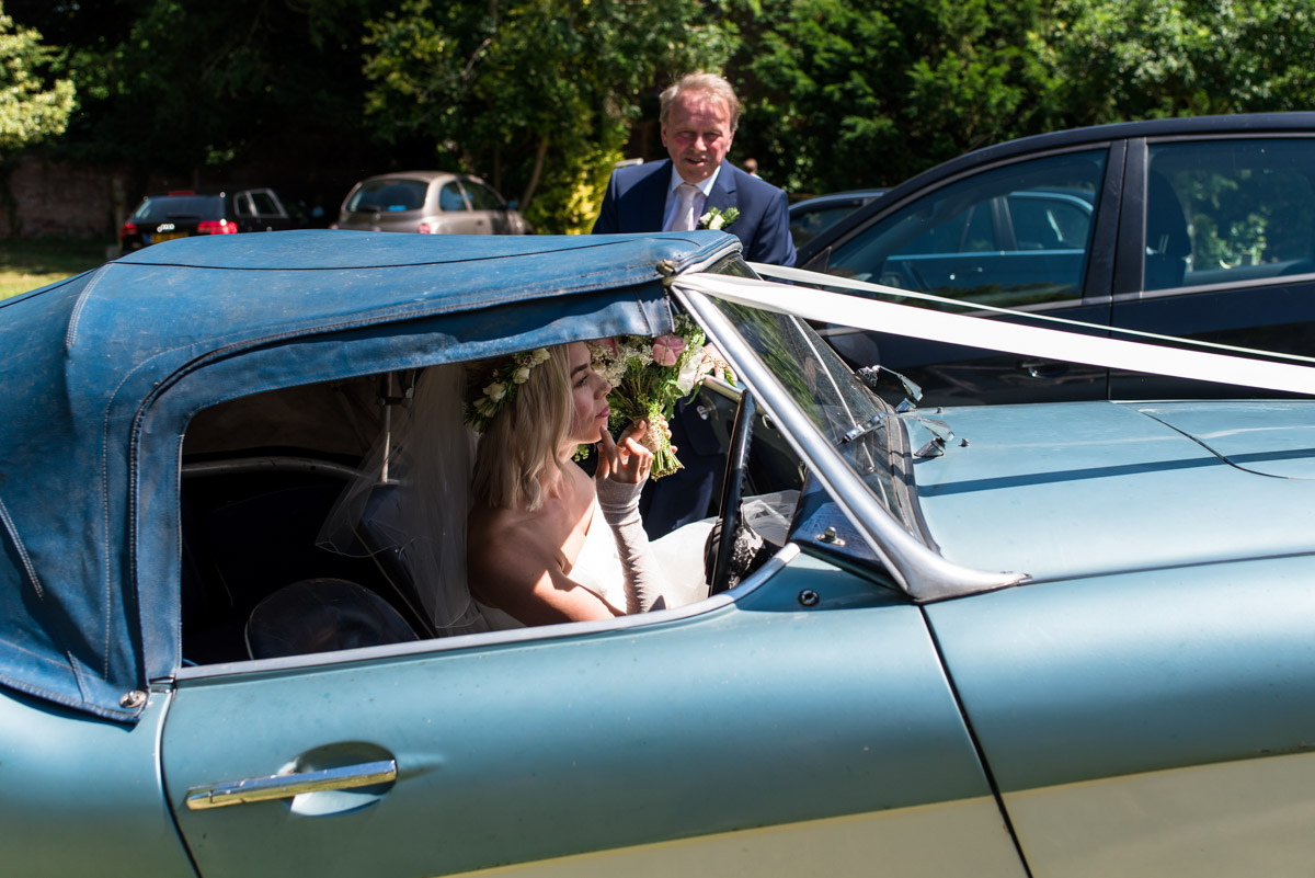 Anne arrives for her Kent church wedding in classic car