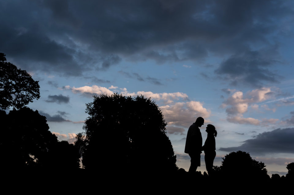 Silhouette of Debbie and Martin at their pre wedding photography shoot at Moat park in Kent
