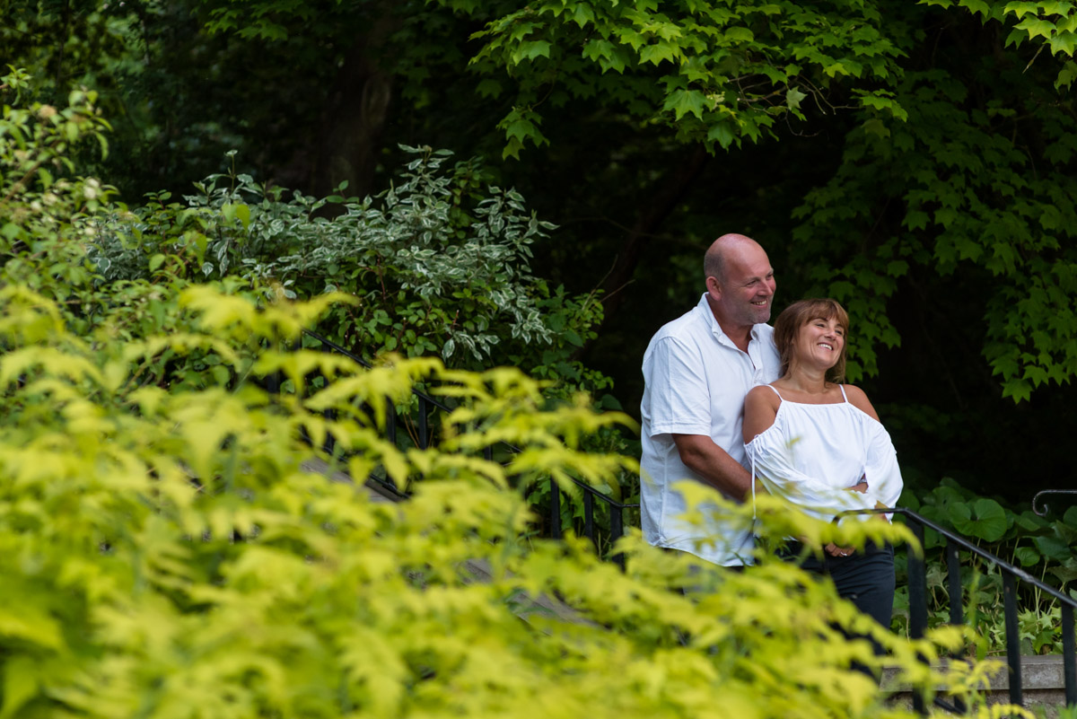 Debbie and Martin photographed together on the steps at Moat park during their pre wedding photography shoot