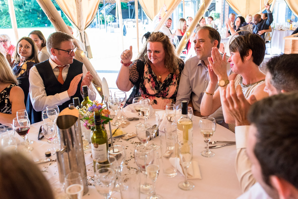 Photograph of wedding guests inside tipis at The Gardens Yalding