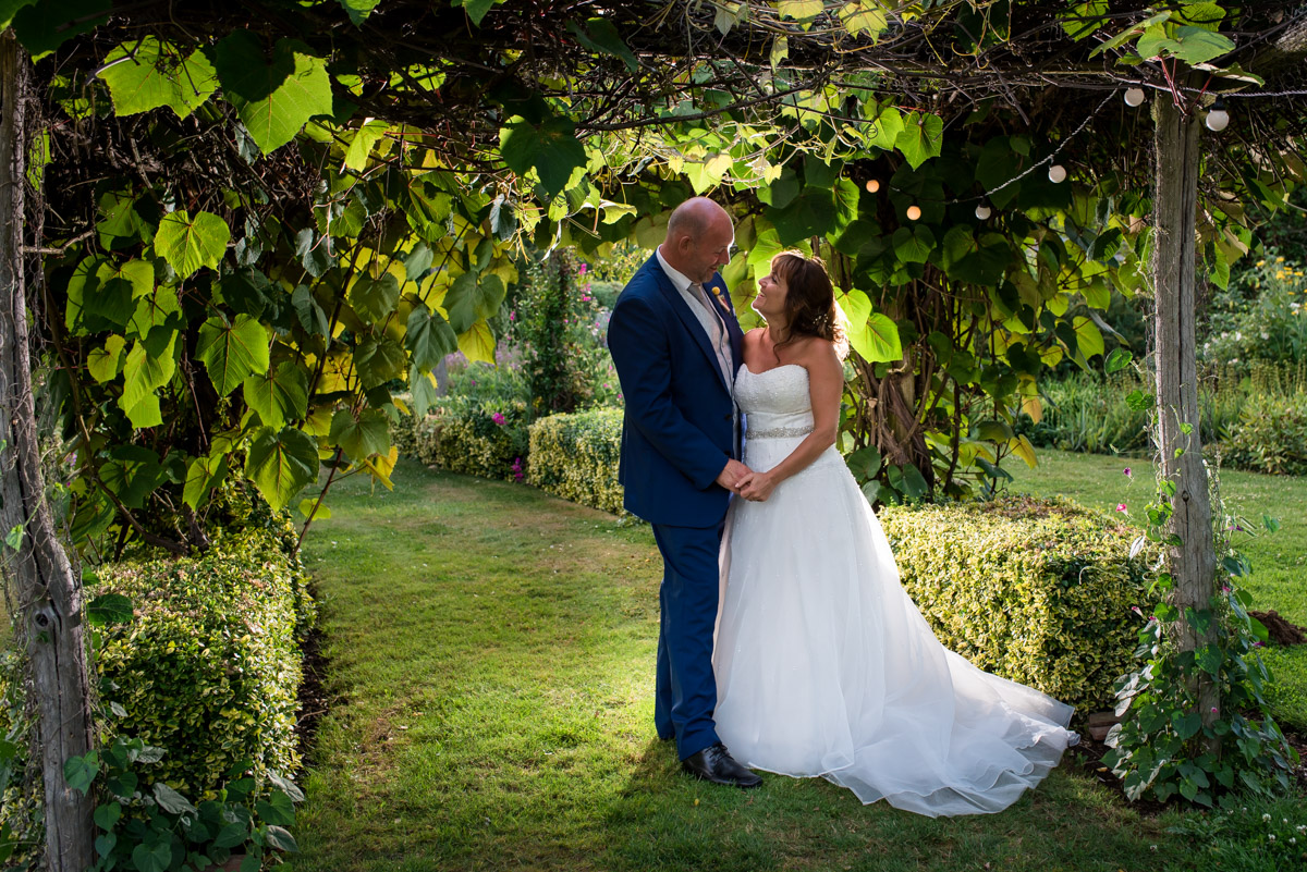 Photograph of Debbie and Martin in The Gardens Yalding on their wedding day