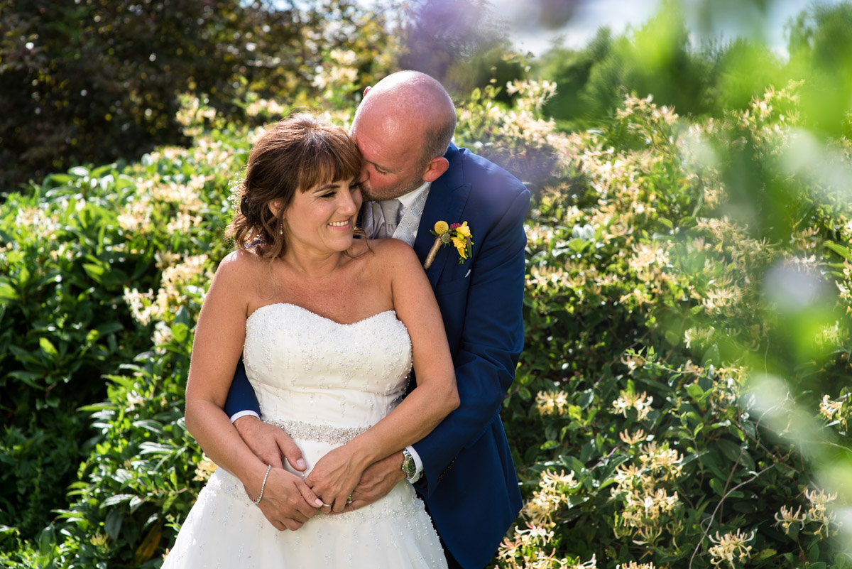 Photograph of Debbie and Martin in the gardens balding after their wedding ceremony