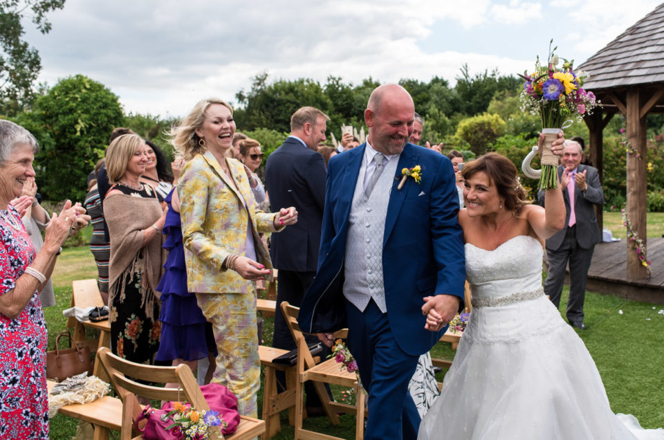 The Garden Yalding wedding photography. Debbie and Martin as they walk back down the aisle