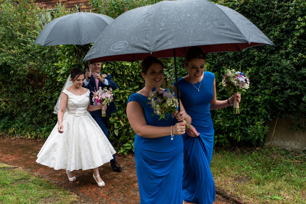 Emily and her bridesmaids photographed arriving for church wedding
