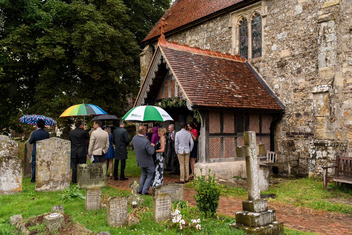 Photograph of wedding guests outside east sussex church