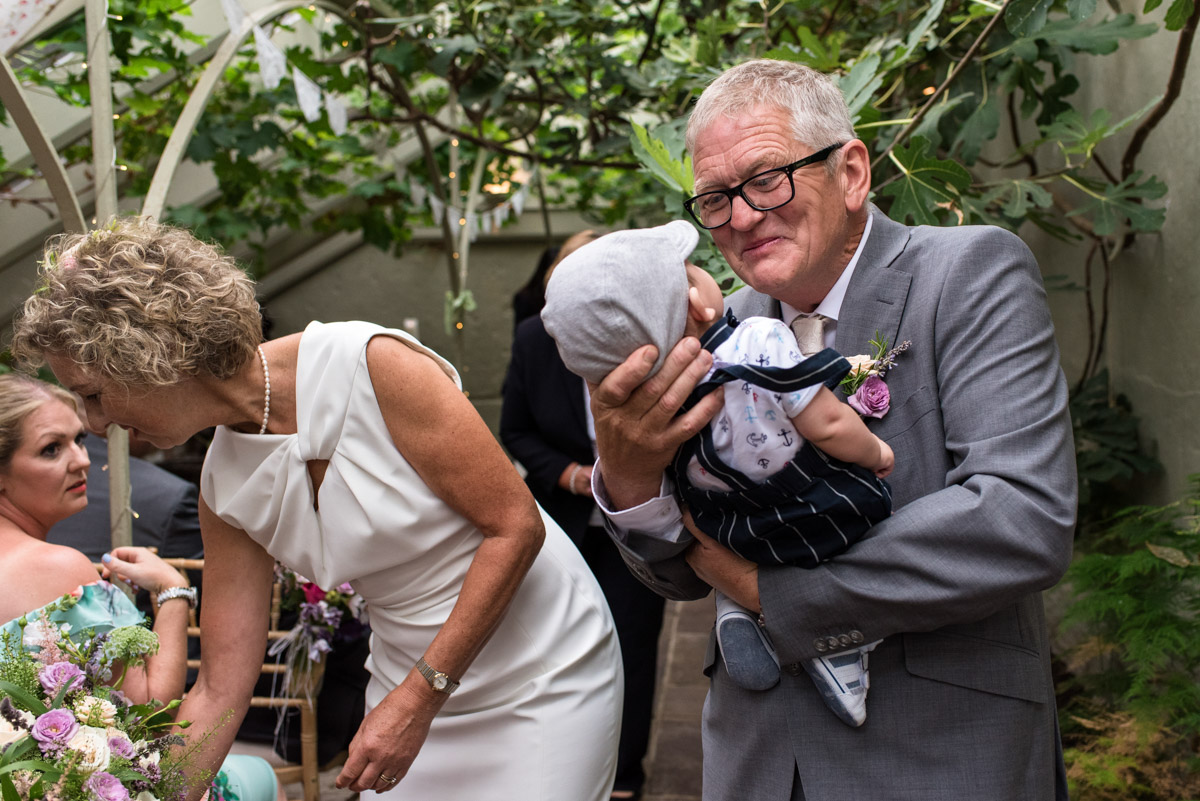 Photograph of John and his grandson after wedding ceremony at The Secret garden