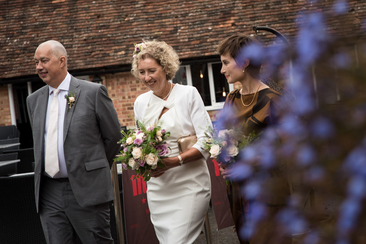The Secret garden wedding photography, Kate walking with her brother and daughter