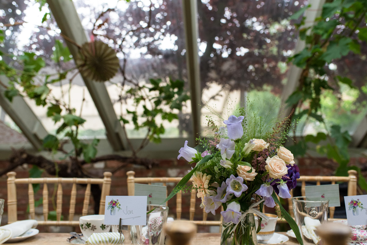Photograph of table decorations in the Glass House at the Secret garden in Kent
