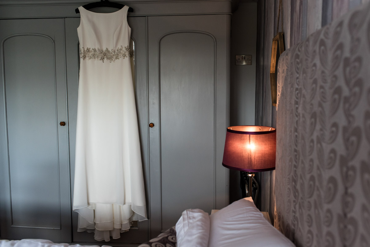 Photograph of wedding dress hanging up at Crescent turner Hotel