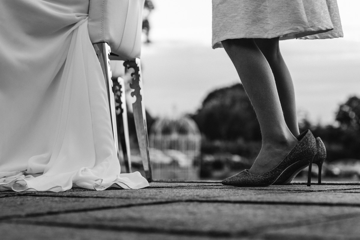 Photograph of bridesmaid wearing brides wedding shoes