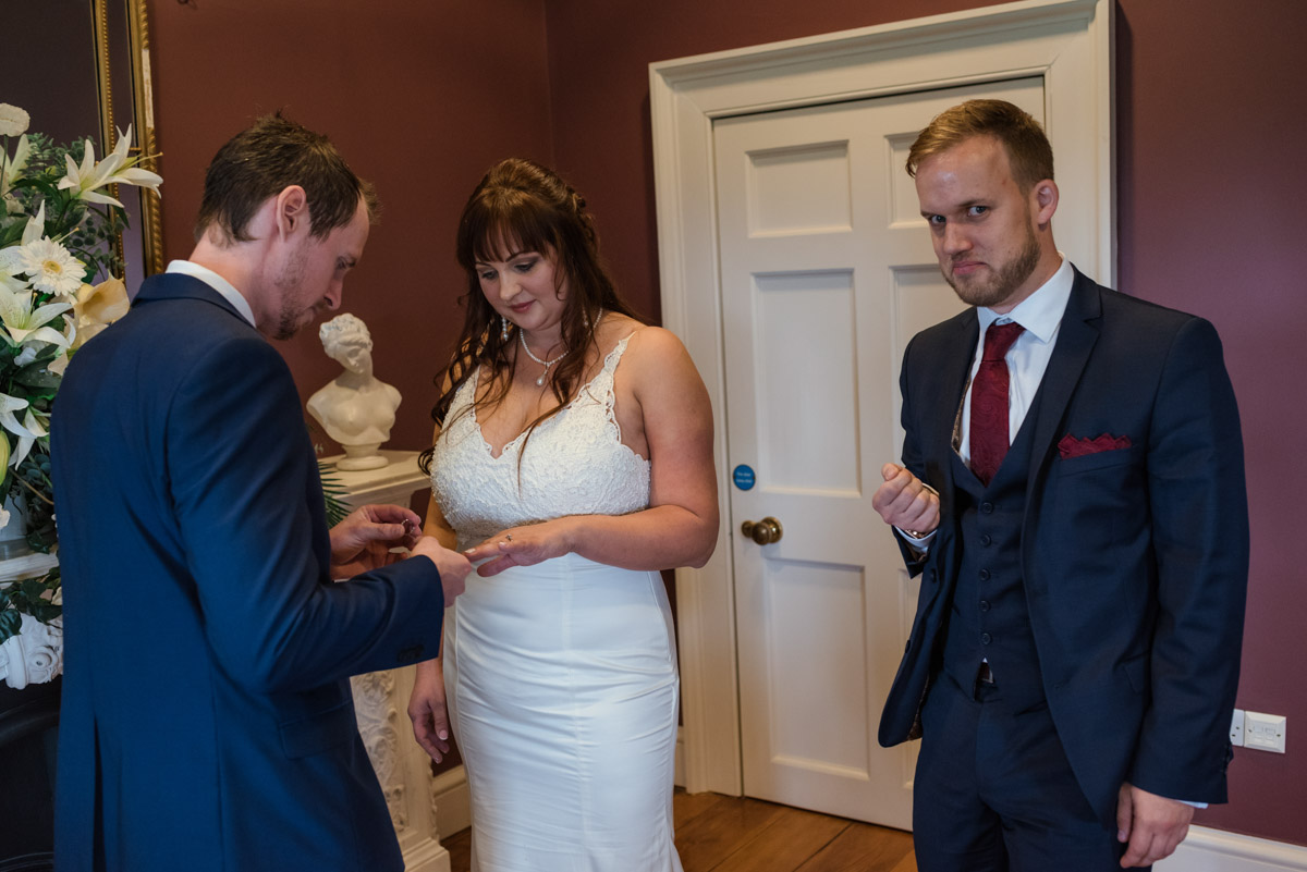 John and Lucie exchange rings at their Danson House wedding