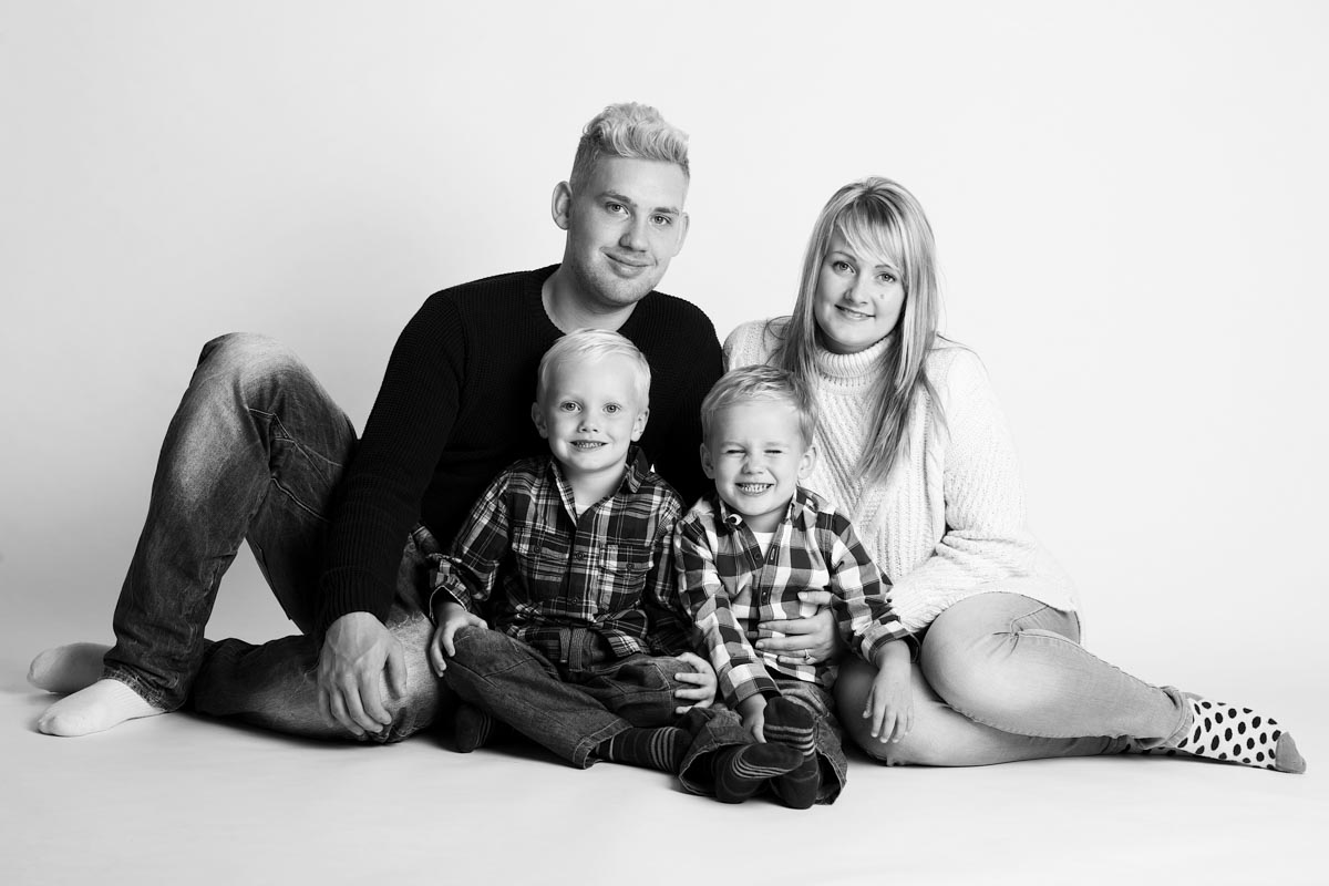 Black and white studio family photograph
