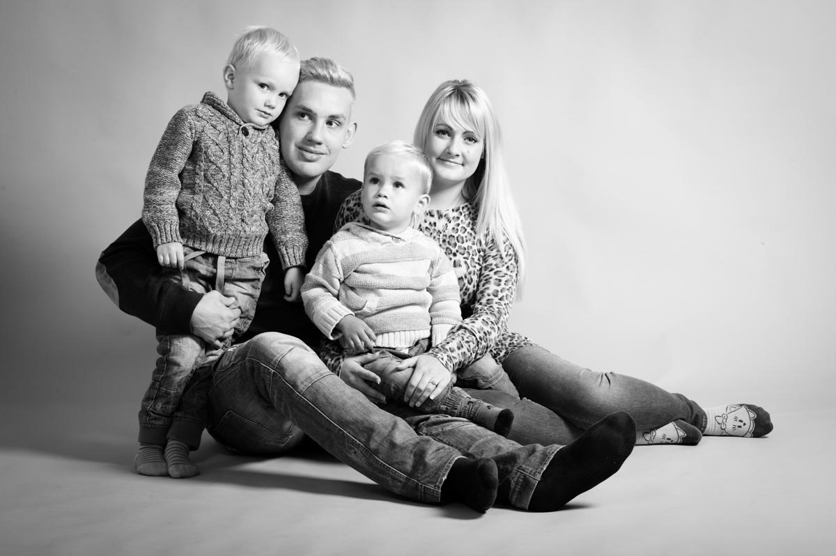 Black and white studio photography of Billy and Aimee and two children