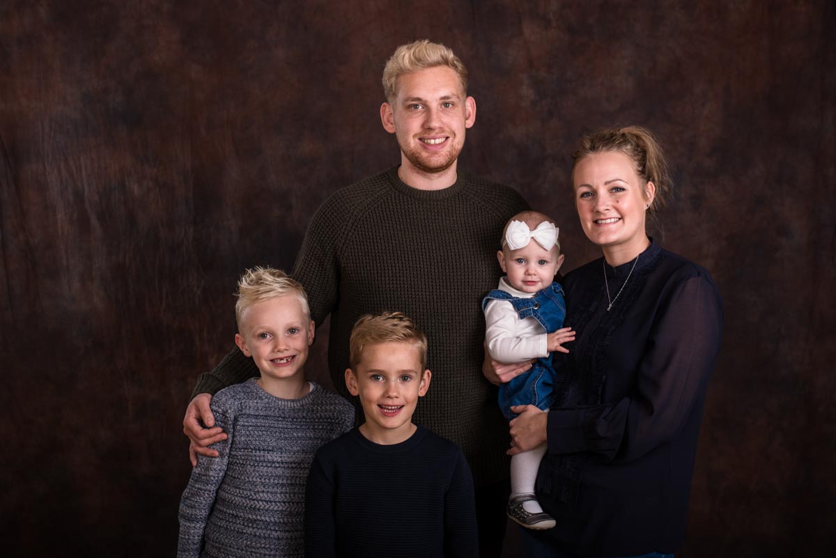 Portrait studio photograph of Aimee and Billy with their children