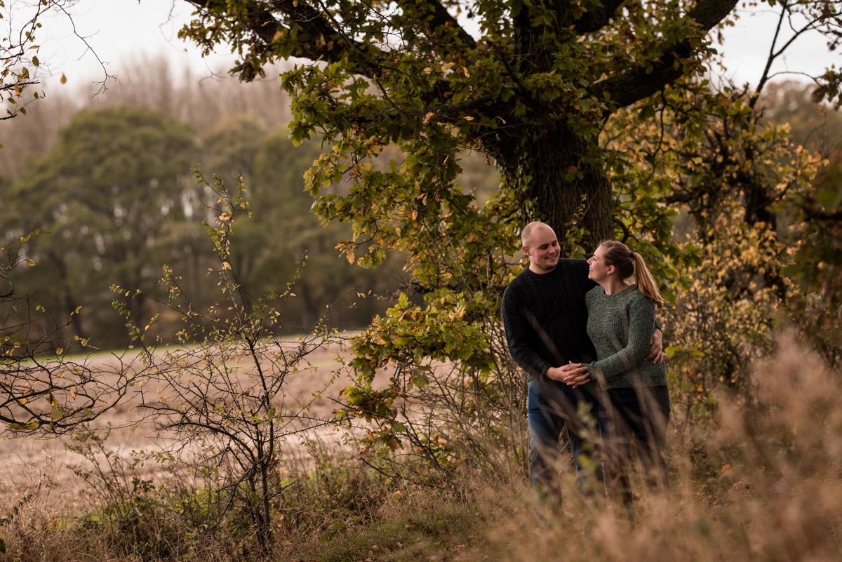 Photograph of Ryan and Rachel walking on the farm at their pre wedding shoot