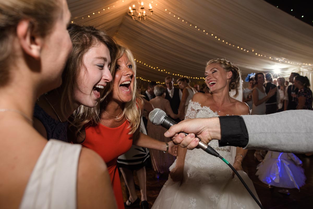 Wedding photograph of guests singing