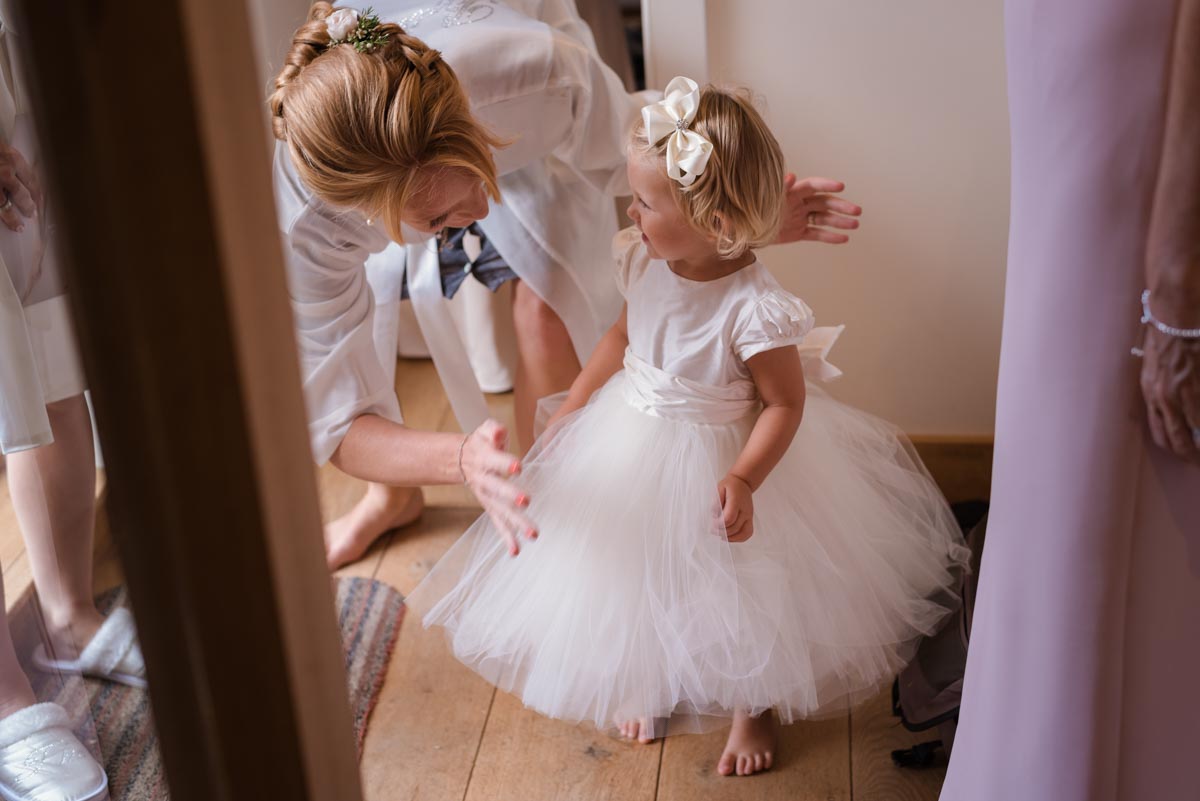 Photograph of flower girl before James and Rebecca's Smarten church wedding in Kent