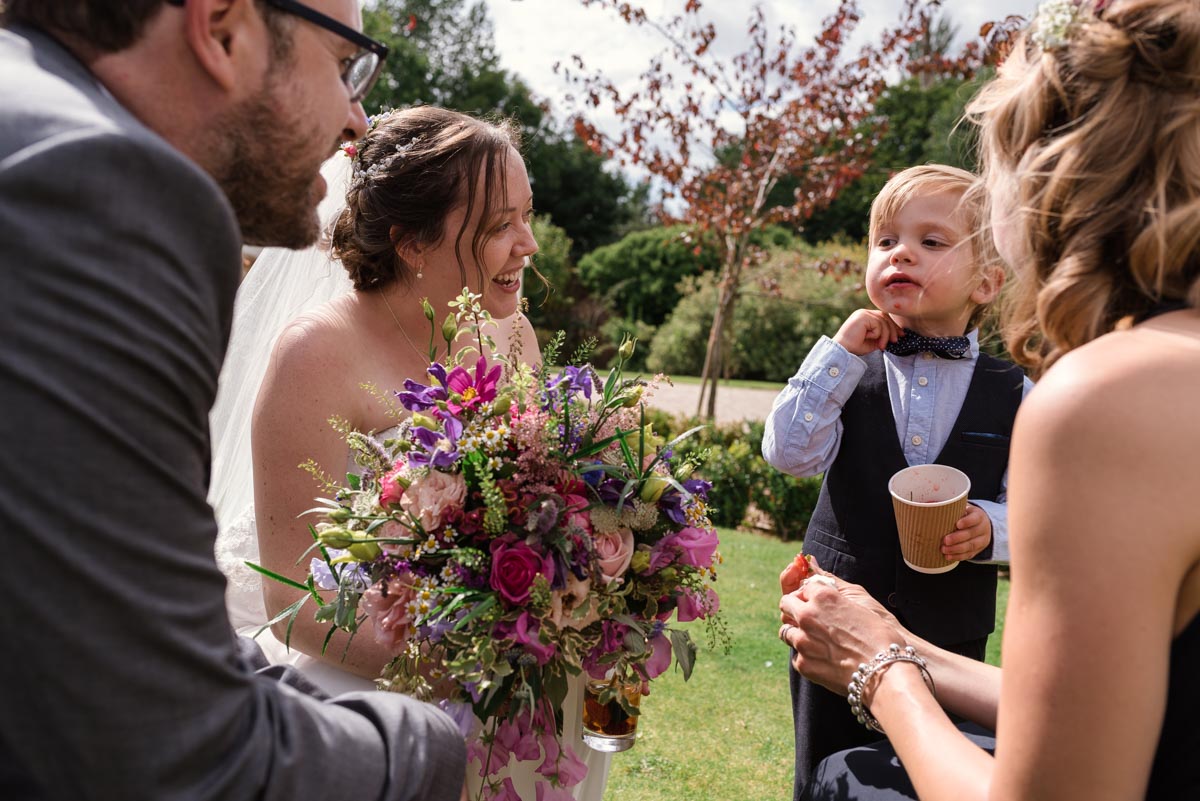 photograph of Chris and Srah talking to their wedding guests