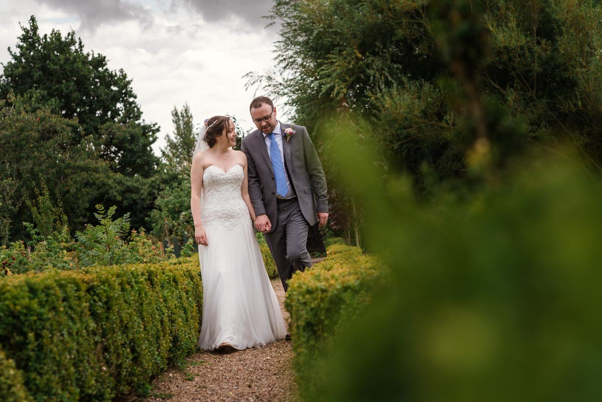 Photograph of sarah and Chris on their wedding day at the secret garden