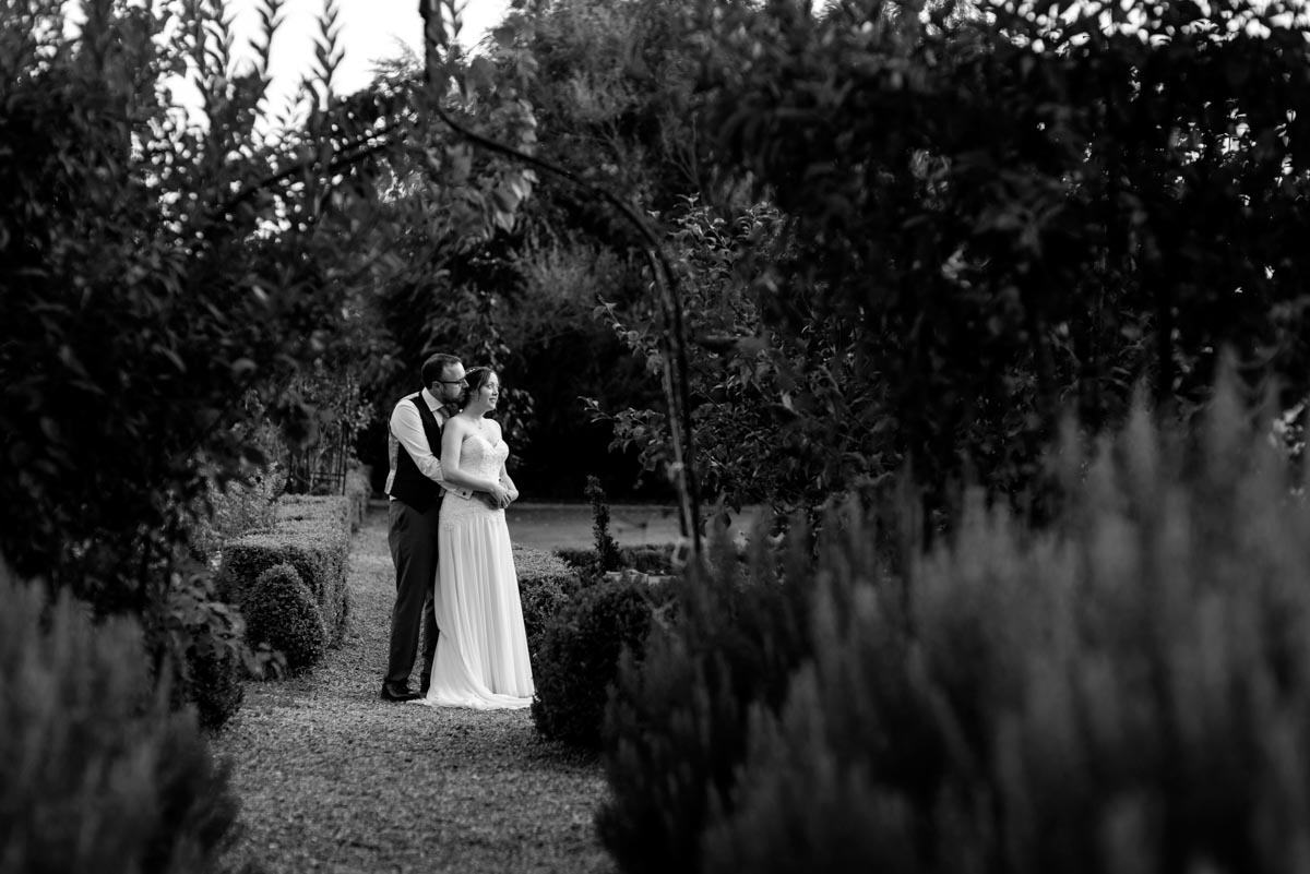 Blacka nd white couple photograph of sarah and chris on their wedding day at the secret garden in kent