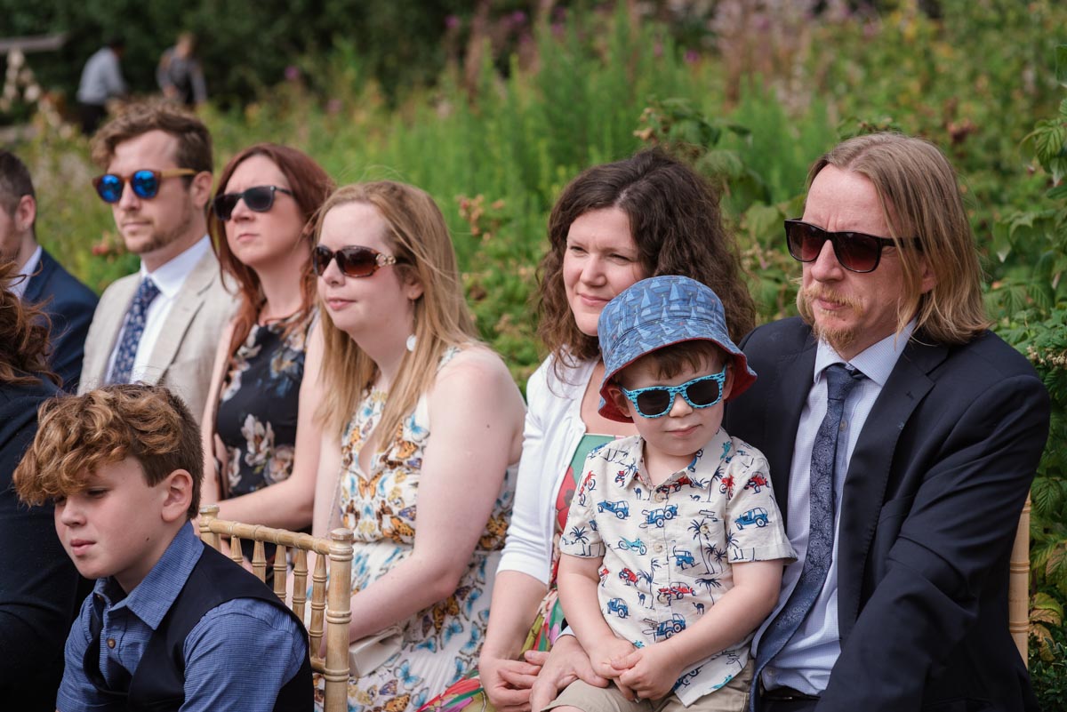Photograph of wedding guests in their sunglasses at The Secret garden in Kent