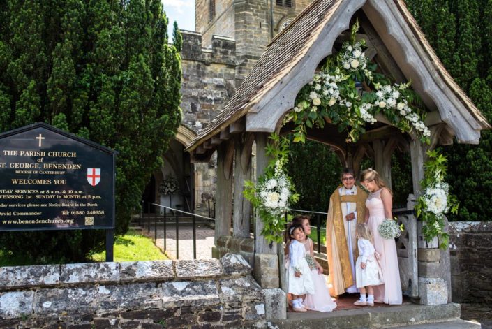 Photograph of flowers over church archway at Benenden Church on wedding day