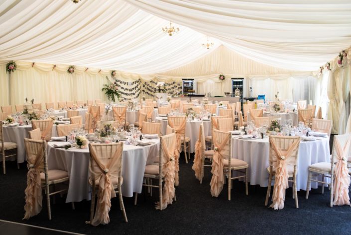 Wedding tables inside marquee at Allington Castle in Kent