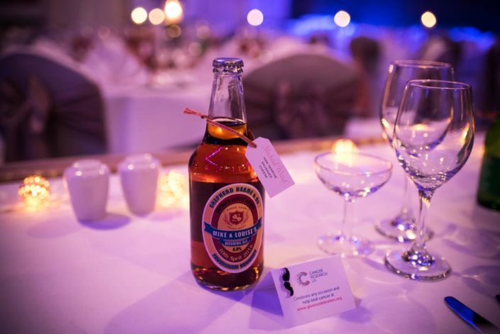 Bottles of beer as table favours at The Shepherd Name wedding venue in Kent