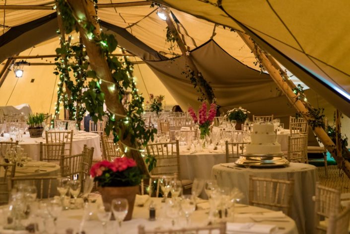 Photograph of wedding tables inside tipis