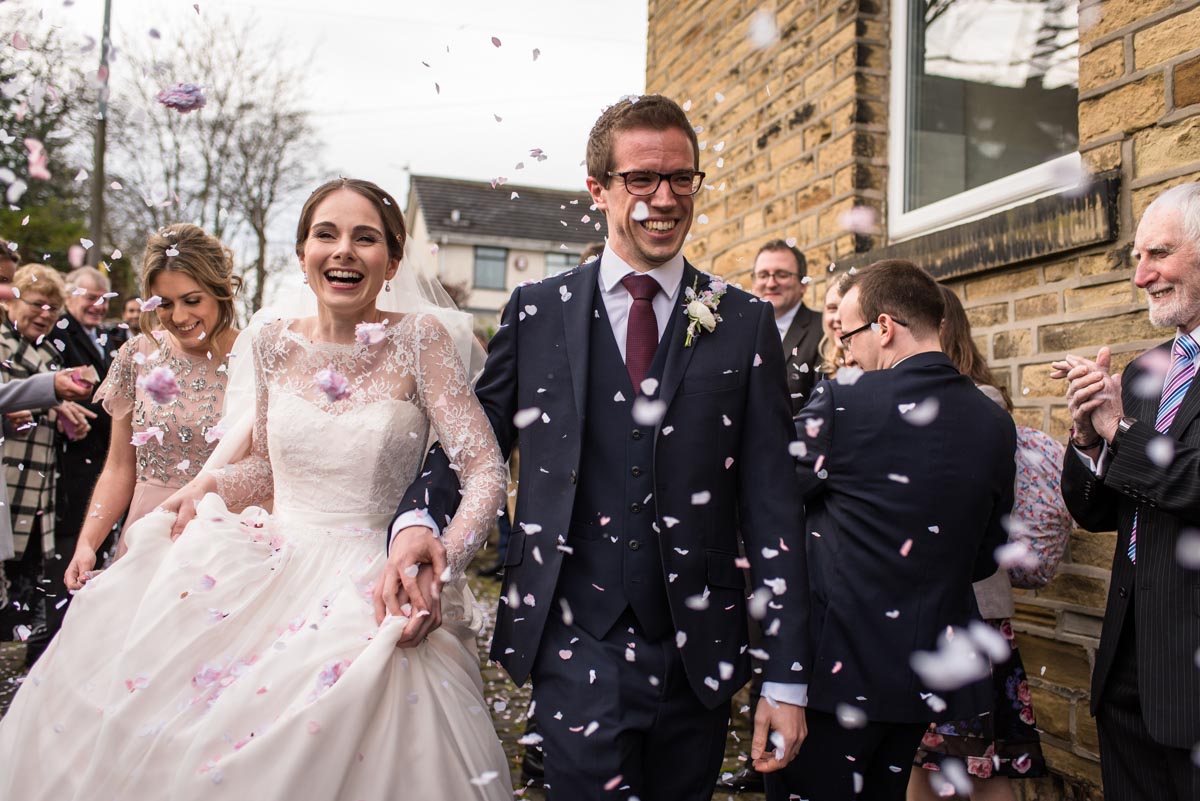 Photograph of Tom and Katherine during wedding confetti throw