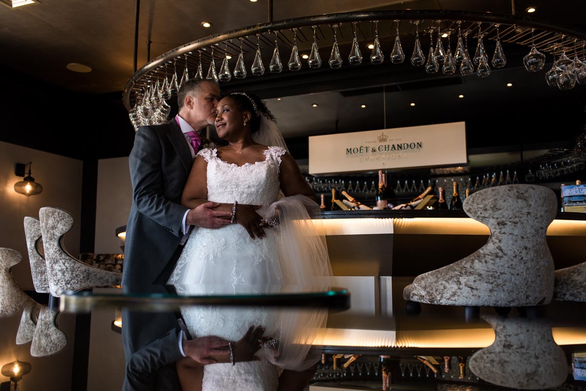 Photograph of wedding couple in Hythe Imperial Hotel champagne bar