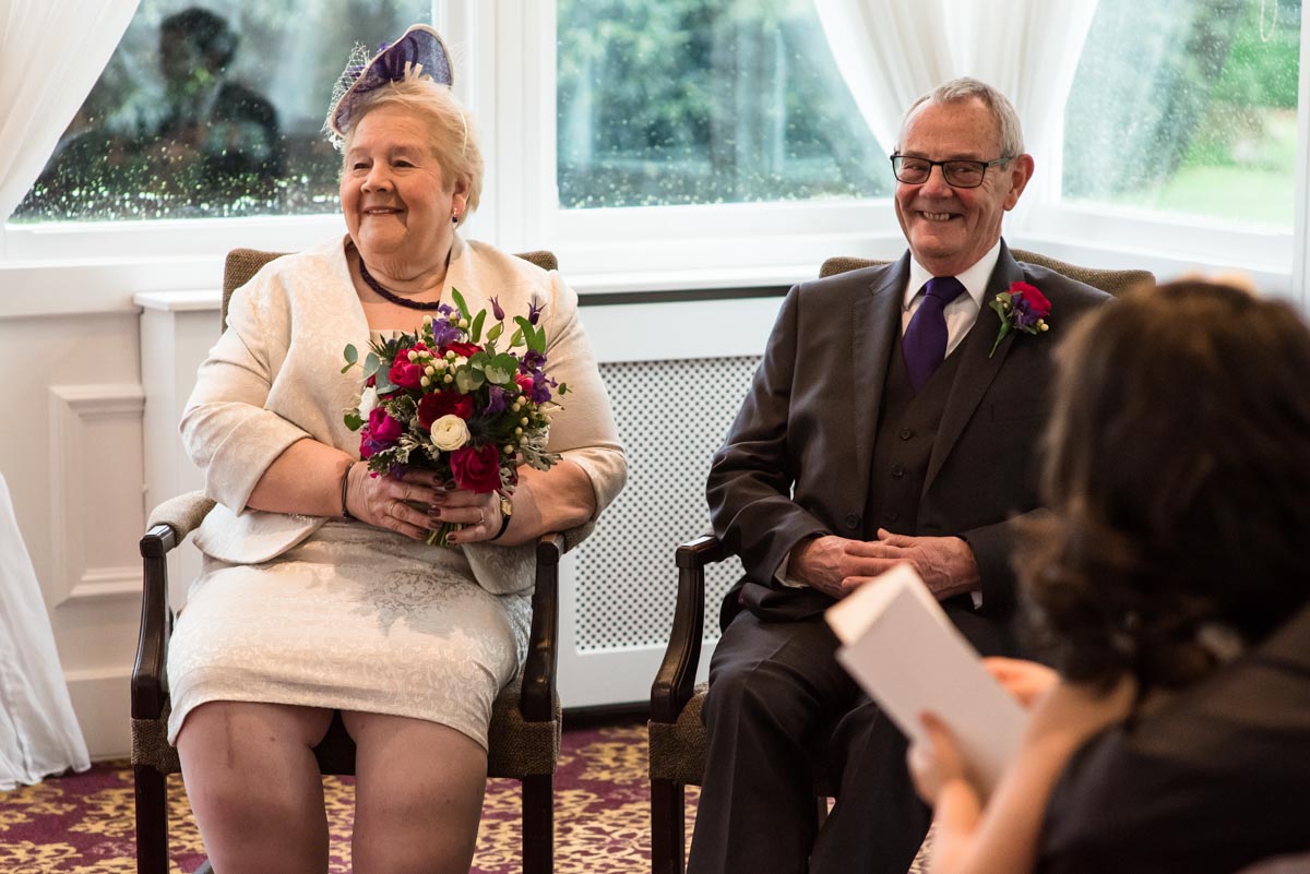 Photoraph of jo and graham during their chilston park hotel wedding ceremony