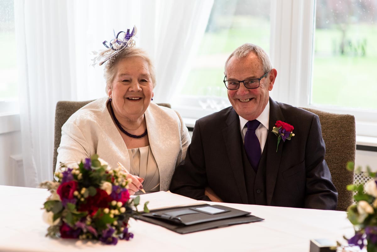 Photograph of Jo and Graham after signing the wedding register at Chiston park in Kent