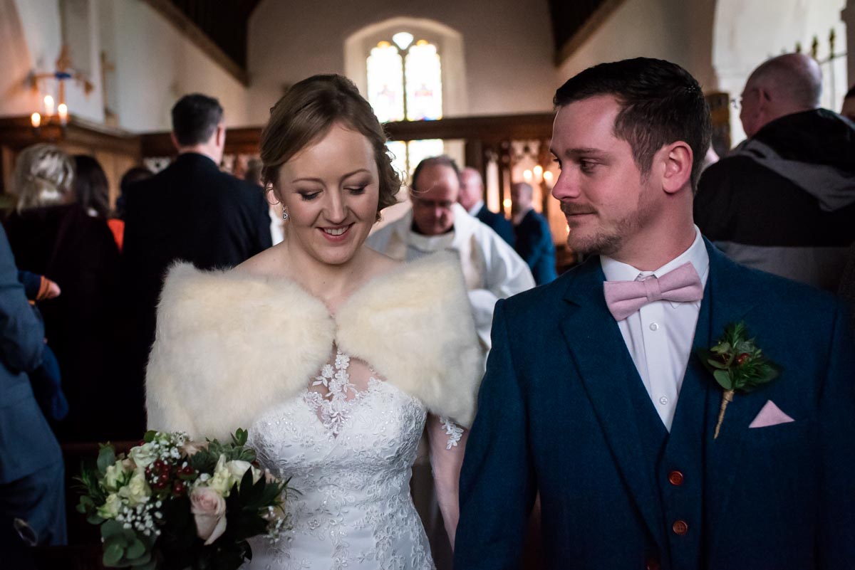 Kent church wedding photography. Stephen and Rebecca leaving after ceremony
