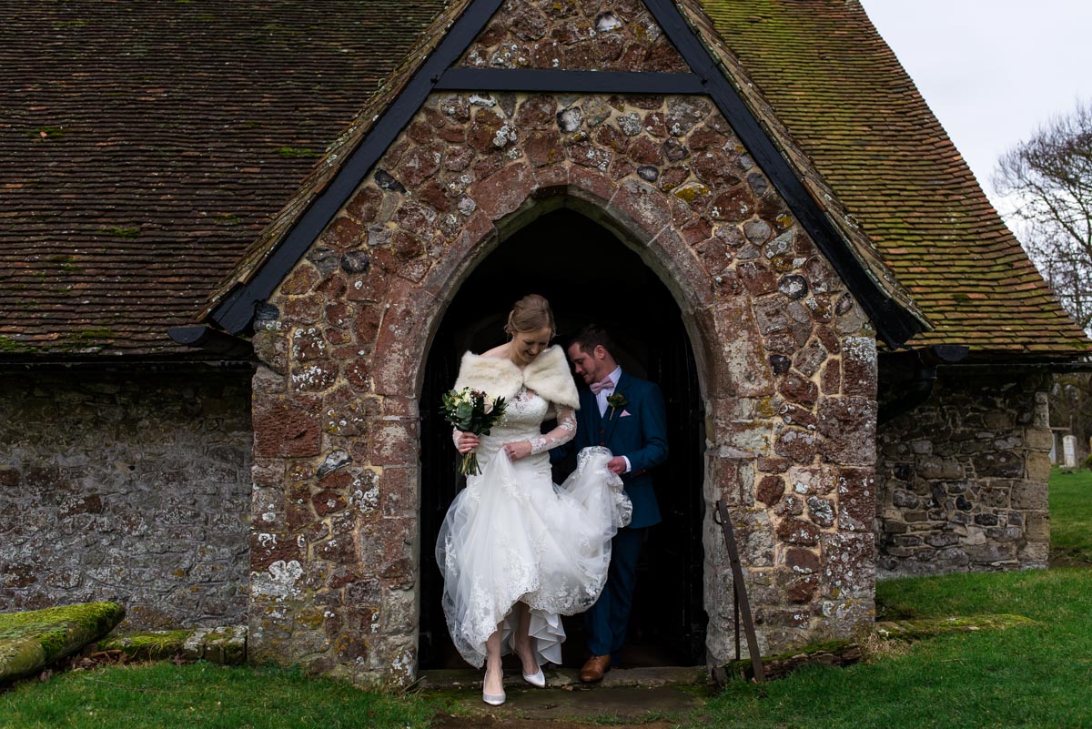 Photograph of Stephen and rebecca at church door after their Kent wedding ceremony
