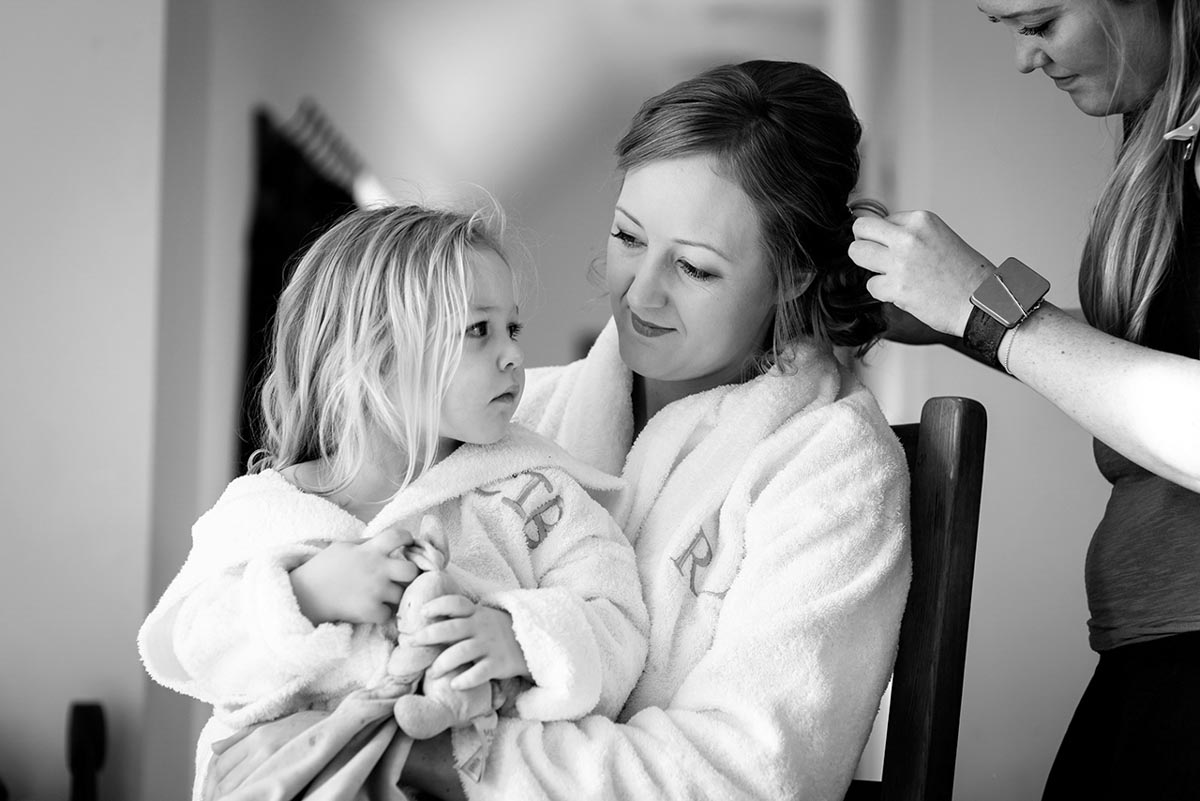 Photograph of Rebecca and her flaoer girl during wedding preparations at Mocketts farm cottages in kent