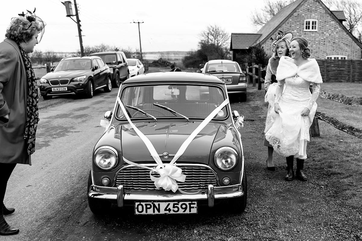 Photograph of bride arriving with mum at Kent church for wedding ceremony