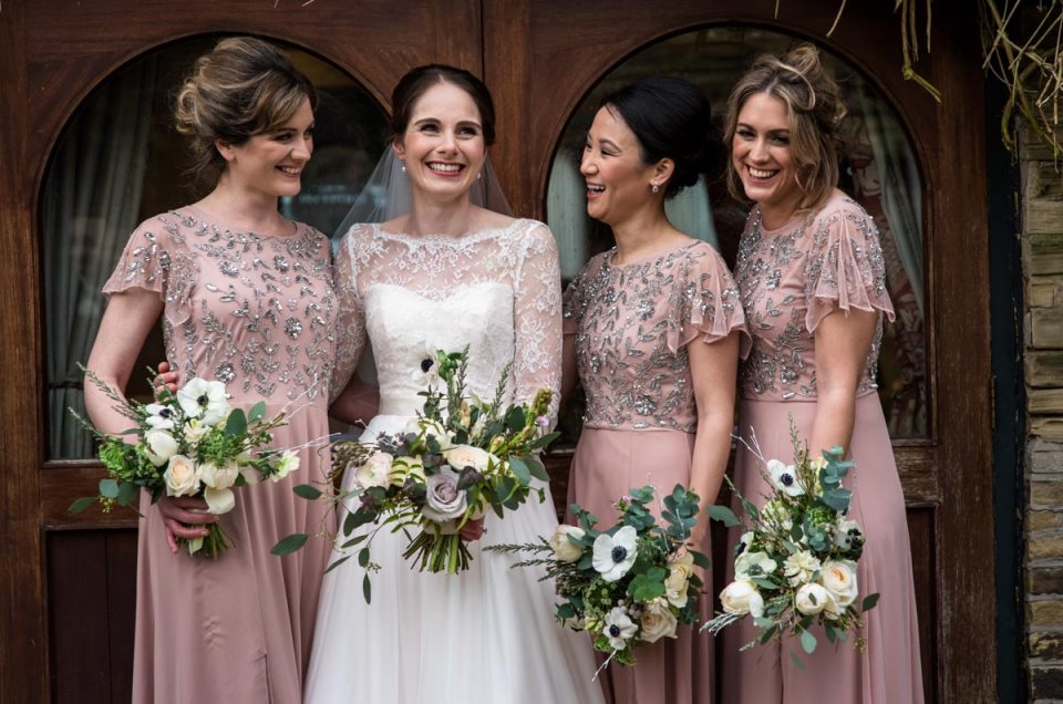 Katherine and her bridesmaids photographed together on her winter wedding day