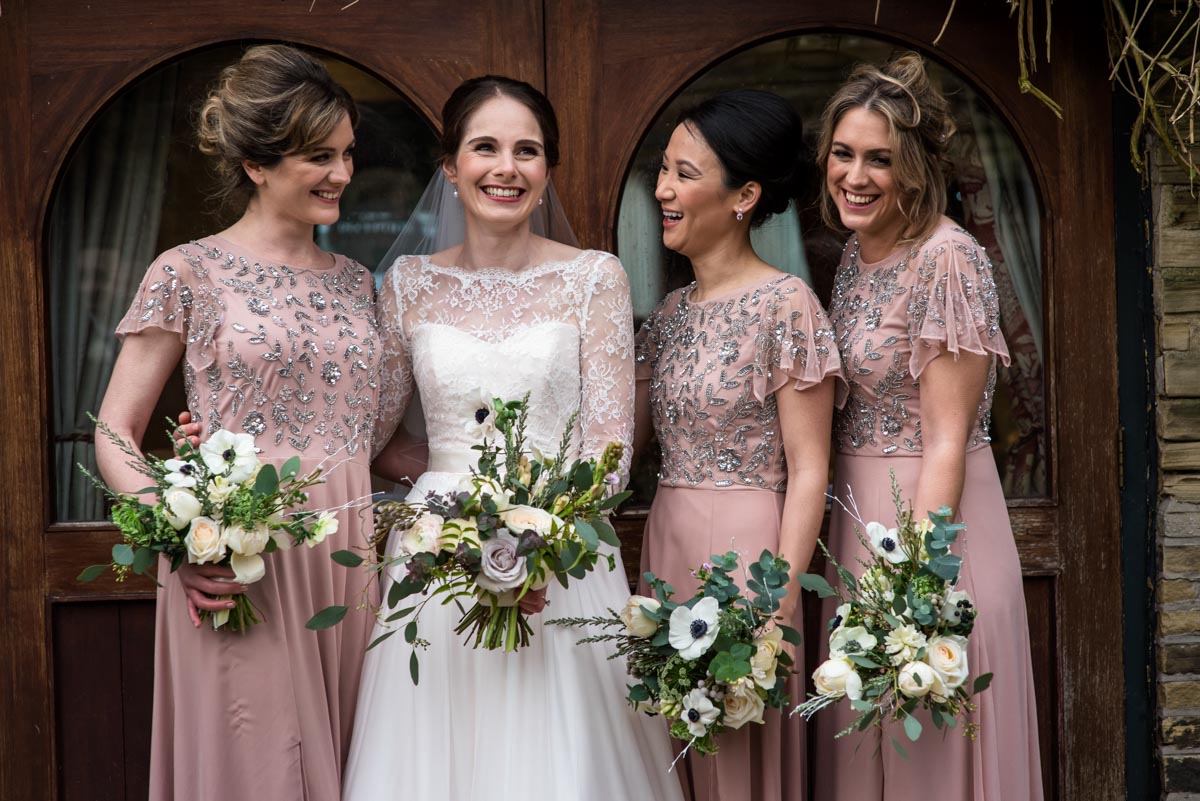 Katherine and her bridesmaids photographed together on her winter wedding day