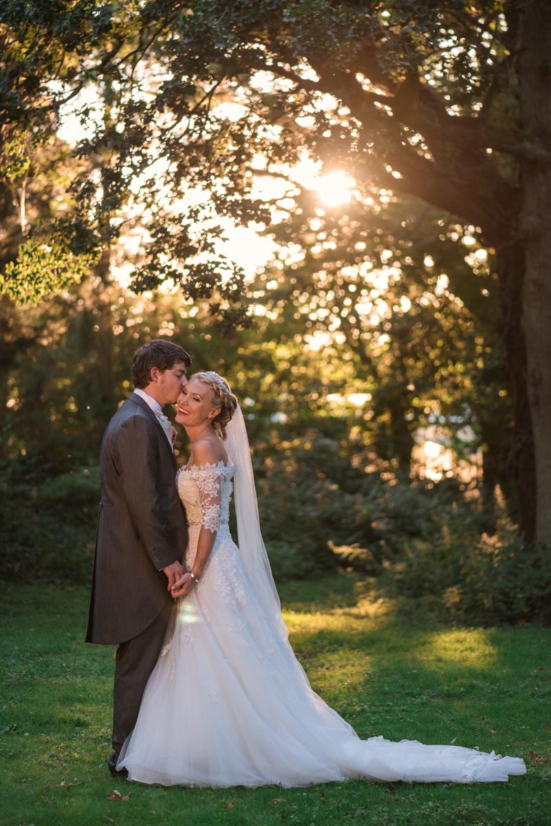 Photoraph of couple photographed on their wedding day during the golden hour