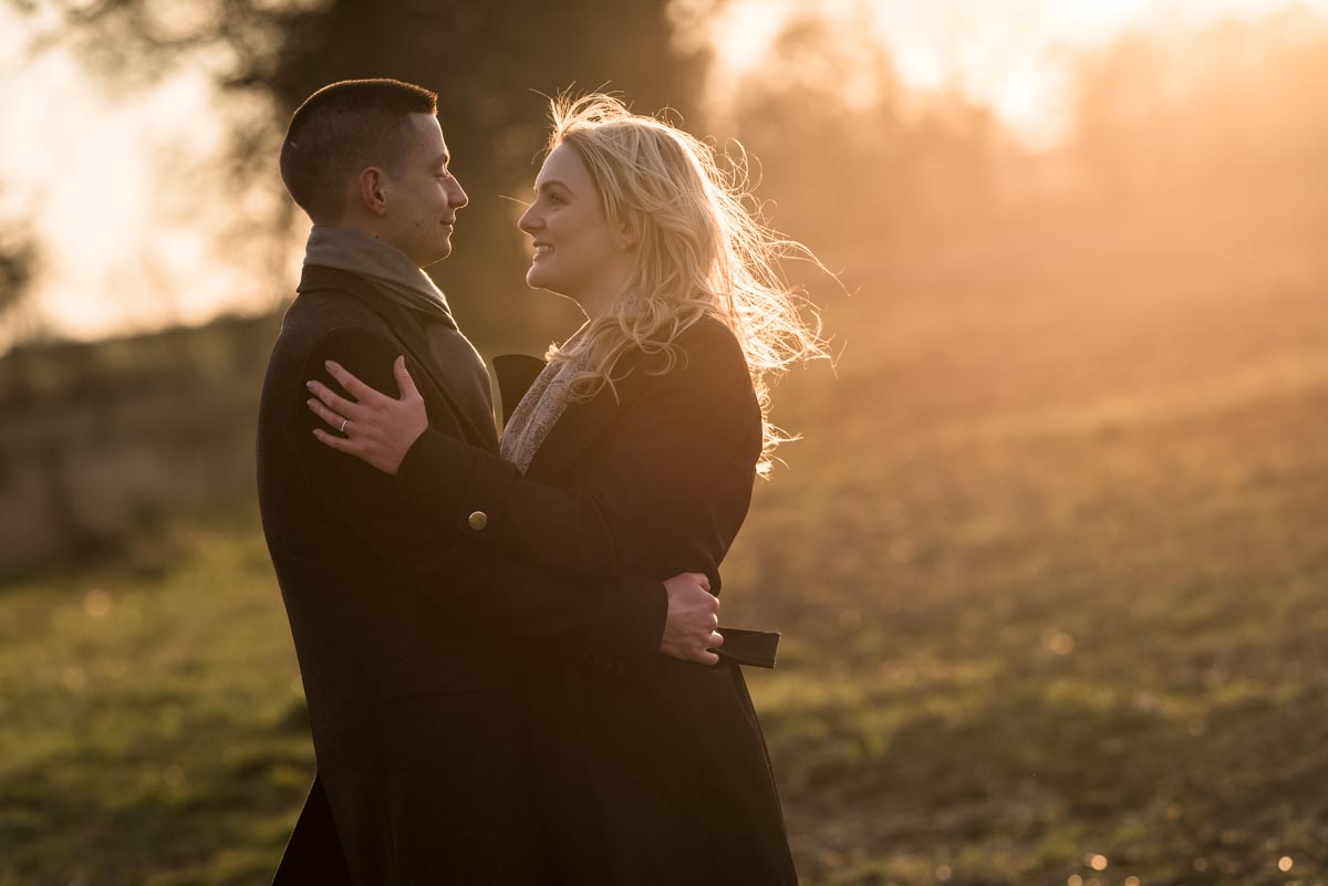 Engagement photography during the golden hour of winter sun on the farm in Kent