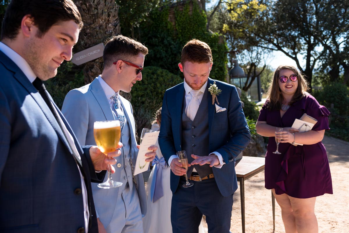 matt and wedding guests are photographed in grounds at castell d'emporda