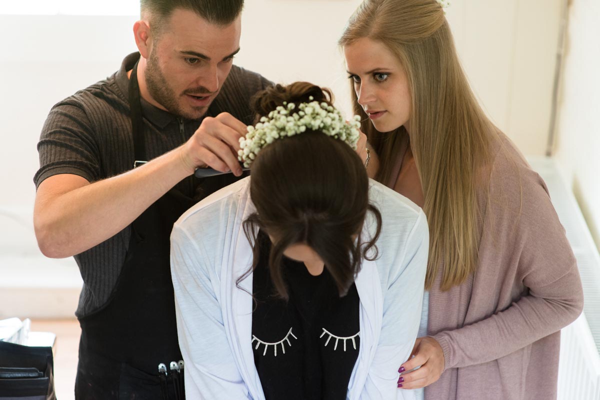Bride having her hair done before her Odo's Barn wedding
