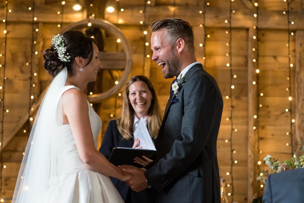 happy moment between Sarah and Craig during their wedding at Odo's Barn wedding in Kent