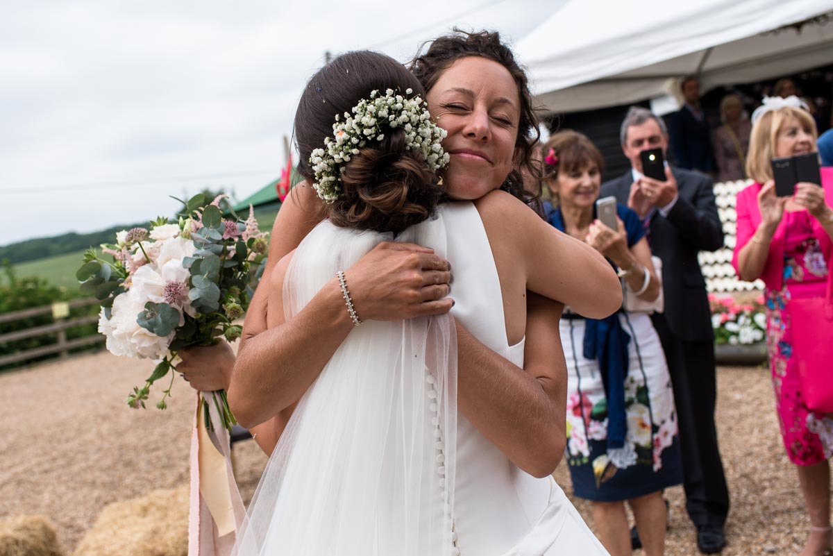 Hugs from friends, odo's Barn wedding photography in Kent