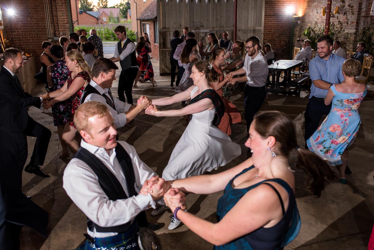 Wedding guests enjoy barn dance at Kent wedding reception